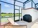 Screened patio with lounge chair and grill at 8971 Stinger Dr, Davenport, FL 33896