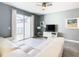 Living room with white sectional sofa and sliding doors to patio at 8971 Stinger Dr, Davenport, FL 33896