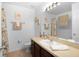 Clean bathroom with a tub, shower, and vanity at 2882 Grasmere View Pkwy, Kissimmee, FL 34746