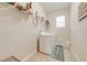 Laundry room with washer, dryer, and overhead shelving at 2662 Trafalgar Blvd, Kissimmee, FL 34758