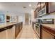 Modern kitchen with stainless steel appliances and granite countertops at 2662 Trafalgar Blvd, Kissimmee, FL 34758