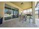 Covered patio with table, chairs, and grill at 2662 Trafalgar Blvd, Kissimmee, FL 34758