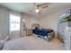 Cozy bedroom with a double bed and grey dresser at 2662 Trafalgar Blvd, Kissimmee, FL 34758