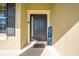 Front door entry with welcome mat and decor at 2662 Trafalgar Blvd, Kissimmee, FL 34758