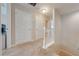 Upstairs hallway with carpeted flooring and access to bedrooms at 2662 Trafalgar Blvd, Kissimmee, FL 34758