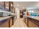 Well-equipped kitchen featuring dark wood cabinets and granite countertops at 2662 Trafalgar Blvd, Kissimmee, FL 34758