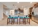 Kitchen island with seating and view into adjacent living space at 2662 Trafalgar Blvd, Kissimmee, FL 34758