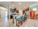 Modern kitchen with stainless steel appliances and an island with seating at 2662 Trafalgar Blvd, Kissimmee, FL 34758