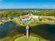 Community clubhouse near lake with walking paths at 2662 Trafalgar Blvd, Kissimmee, FL 34758