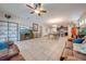 Open living room with tile floors, comfortable seating, and built-in shelving at 2662 Trafalgar Blvd, Kissimmee, FL 34758