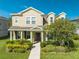 Two story house with landscaping and walkway at 2662 Trafalgar Blvd, Kissimmee, FL 34758