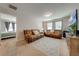 Spacious bonus room with two sofas and a view to another bedroom at 2662 Trafalgar Blvd, Kissimmee, FL 34758