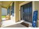 Front porch with door, bench, and welcome decor at 2662 Trafalgar Blvd, Kissimmee, FL 34758