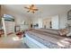 Main bedroom with ample space, dresser, and access to en-suite bathroom at 2662 Trafalgar Blvd, Kissimmee, FL 34758