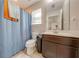 Clean bathroom with shower/tub combo and updated vanity at 2662 Trafalgar Blvd, Kissimmee, FL 34758
