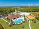 Aerial view of community amenities including pool, playground, and clubhouse at 2662 Trafalgar Blvd, Kissimmee, FL 34758