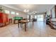 Bright dining room with hardwood floors and large windows at 2662 Trafalgar Blvd, Kissimmee, FL 34758