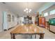 Bright dining room with a wooden table, view of kitchen and Gathering room at 2662 Trafalgar Blvd, Kissimmee, FL 34758