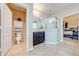 Bathroom includes toilet, vanity with dark wood cabinets and shower at 2662 Trafalgar Blvd, Kissimmee, FL 34758