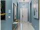 Bright entryway with a large mirror and modern light fixture at 1735 Oak Blossom Dr, Davenport, FL 33837