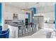 Modern kitchen with white cabinets, large island, and stainless steel appliances at 1735 Oak Blossom Dr, Davenport, FL 33837