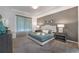 Spacious main bedroom with plush carpet and large bed at 8963 Amelia Downs Trl, Kissimmee, FL 34747