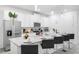 Modern kitchen with white cabinets, stainless steel appliances, and an island at 8963 Amelia Downs Trl, Kissimmee, FL 34747