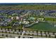 Resort-style community pool with a large deck and a playground at 8963 Amelia Downs Trl, Kissimmee, FL 34747