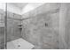 Large walk-in shower with gray tile at 8963 Amelia Downs Trl, Kissimmee, FL 34747