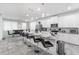Modern kitchen with stainless steel appliances and breakfast bar at 8963 Amelia Downs Trl, Kissimmee, FL 34747