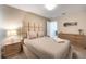 Cozy bedroom with light neutral tones and dresser at 8963 Amelia Downs Trl, Kissimmee, FL 34747