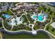 Community pool and recreation area with a lake view at 8963 Amelia Downs Trl, Kissimmee, FL 34747