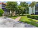 Building exterior with a walkway and lush lawn at 1130 N Lake Parker Ave # C129, Lakeland, FL 33805