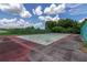 Community tennis court with chain link fence at 1130 N Lake Parker Ave # C129, Lakeland, FL 33805