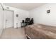 Bedroom with bed, gaming chair and computer setup at 1130 N Lake Parker Ave # C129, Lakeland, FL 33805