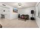 Living room with tiled floors, couch, and entertainment center at 1130 N Lake Parker Ave # C129, Lakeland, FL 33805