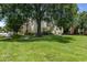 Building exterior with landscaping and walkways at 1130 N Lake Parker Ave # C129, Lakeland, FL 33805