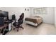 Bedroom with a bed, gaming setup and plenty of floor space at 1130 N Lake Parker Ave # C129, Lakeland, FL 33805
