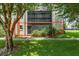 Condo building exterior with lush landscaping at 1130 N Lake Parker Ave # C129, Lakeland, FL 33805
