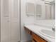 Bright bathroom with white sink and vanity, and mirrored medicine cabinet at 1130 N Lake Parker Ave # C129, Lakeland, FL 33805