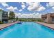 Community swimming pool with lake view at 1130 N Lake Parker Ave # C129, Lakeland, FL 33805
