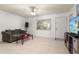 Living Room with tiled floor, couch, and TV at 1130 N Lake Parker Ave # C129, Lakeland, FL 33805