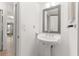 Simple bathroom with a pedestal sink and mirrored medicine cabinet at 1130 N Lake Parker Ave # C129, Lakeland, FL 33805