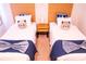 Twin bedroom with two beds and calming decor at 3006 Red Ginger Rd, Kissimmee, FL 34747