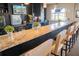 Community clubhouse bar with granite counter and seating at 3006 Red Ginger Rd, Kissimmee, FL 34747