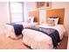 Twin bedroom with two beds and calming decor at 3006 Red Ginger Rd, Kissimmee, FL 34747