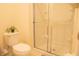 Clean bathroom with a shower and toilet at 3006 Red Ginger Rd, Kissimmee, FL 34747