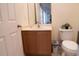 Bathroom with a vanity, toilet, and mirror at 3006 Red Ginger Rd, Kissimmee, FL 34747