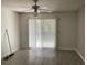 Living room with sliding glass doors and tile floors at 2022 Royal Bay Blvd # 93, Kissimmee, FL 34746