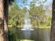 Charming water fountain with a rainbow in the background at 2022 Royal Bay Blvd # 93, Kissimmee, FL 34746
